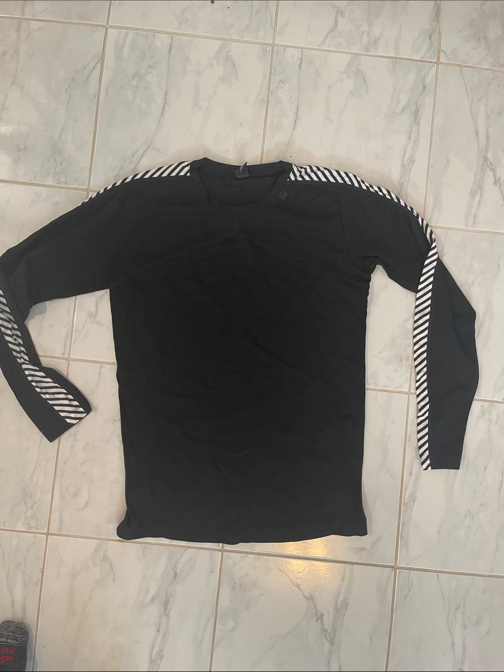 Helly Hansen Black Long-Sleeve Shirt with Diagonal Stripe Trim along the arms